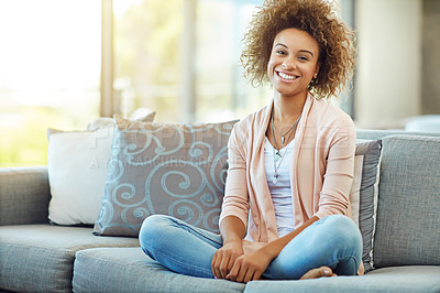 Buy stock photo Portrait of a young woman relaxing on the sofa at home