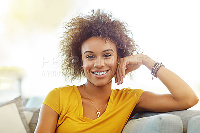 Buy stock photo Portrait of a young woman relaxing on the sofa at home