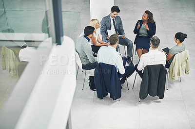 Buy stock photo Teamwork, working together and strategy with a female leader and group or team of business people and colleagues talking in a meeting. Discussing plans and ideas in a workshop or seminar from above