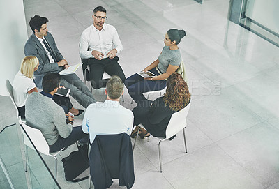 Buy stock photo Support, care and unity by colleagues in a business meeting, sitting together in a modern office. Above a creative team brainstorming, planning and sharing an idea or goal while huddled in a circle
