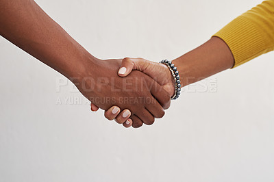 Buy stock photo Cropped shot of colleagues shaking hands