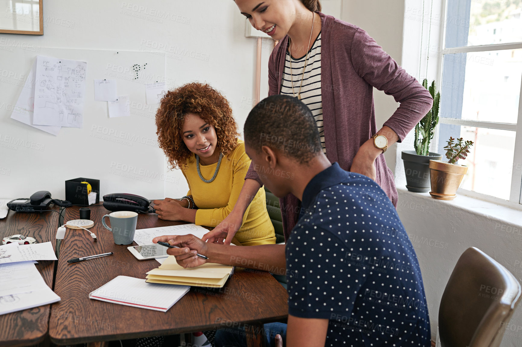 Buy stock photo Shot of a group of colleagues having a meeting in a modern office