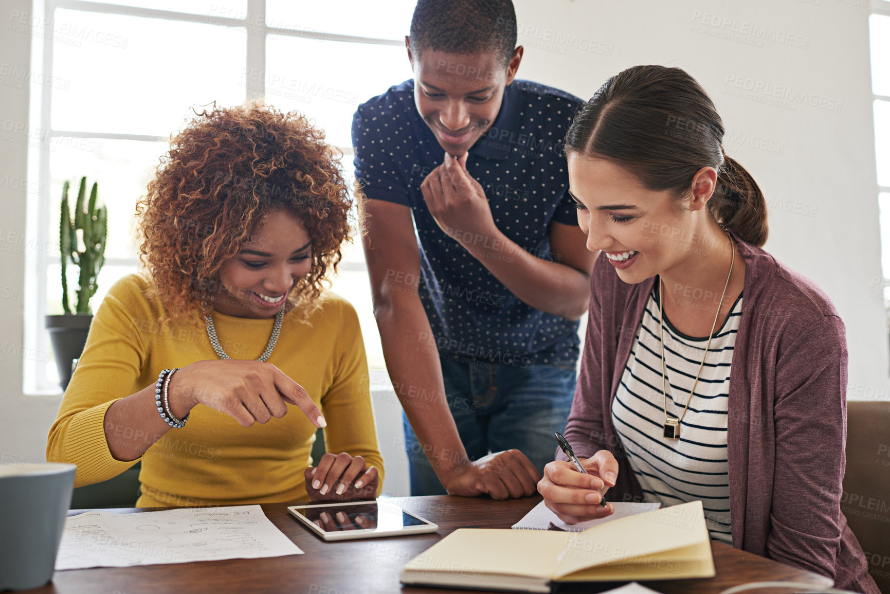 Buy stock photo Shot of a group of colleagues having a meeting in a modern office