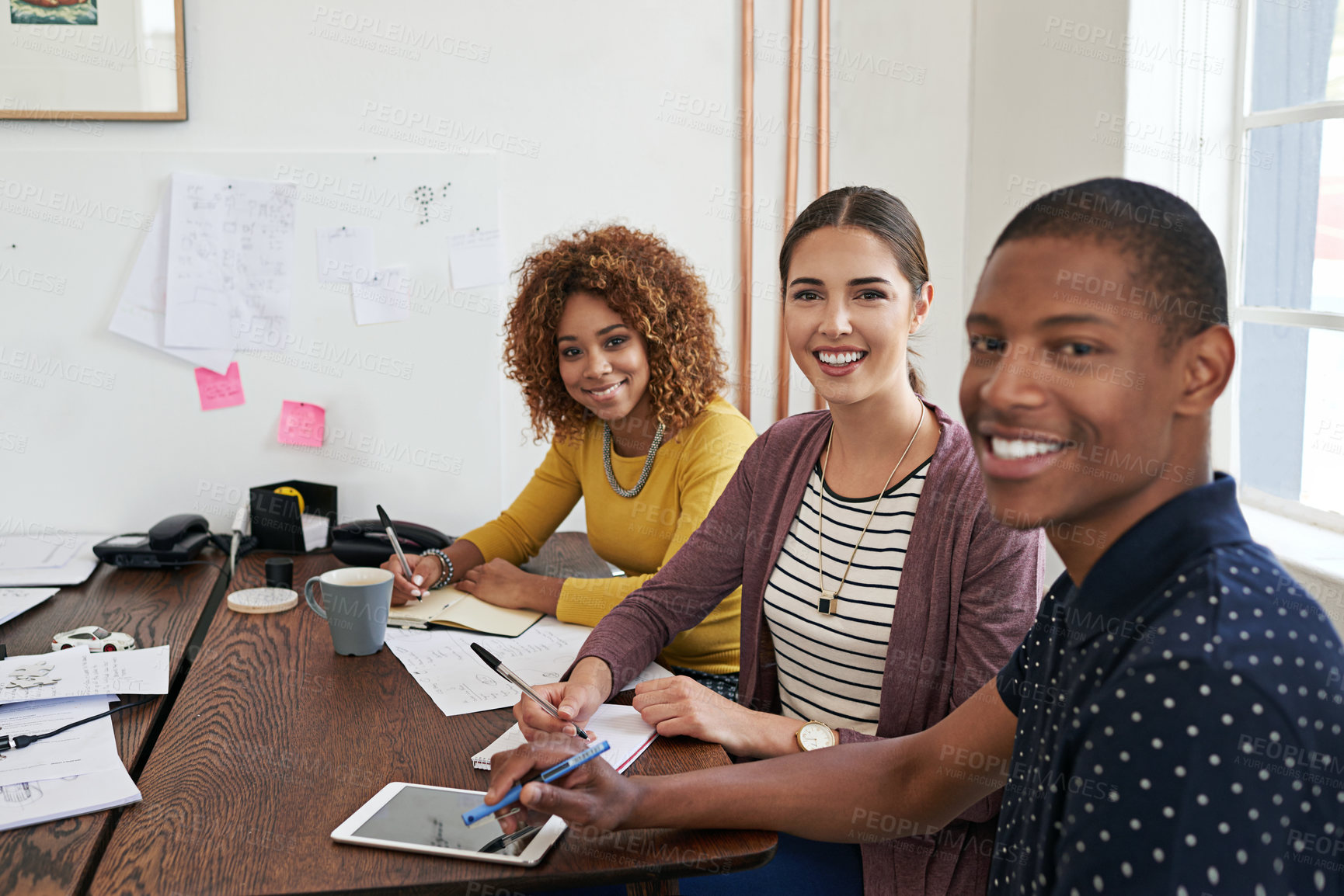 Buy stock photo Shot of a group of colleagues having a meeting in a modern office