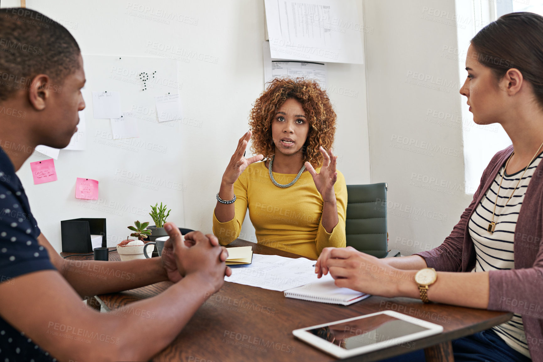 Buy stock photo Shot of a group of colleagues having a meeting in a modern office