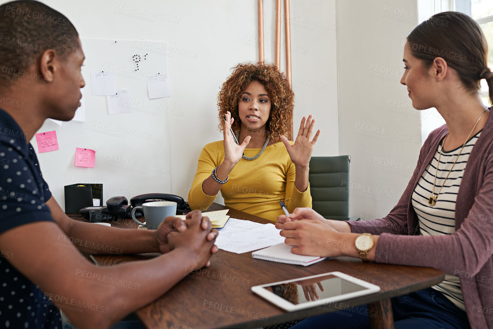 Buy stock photo Shot of a group of colleagues having a meeting in a modern office