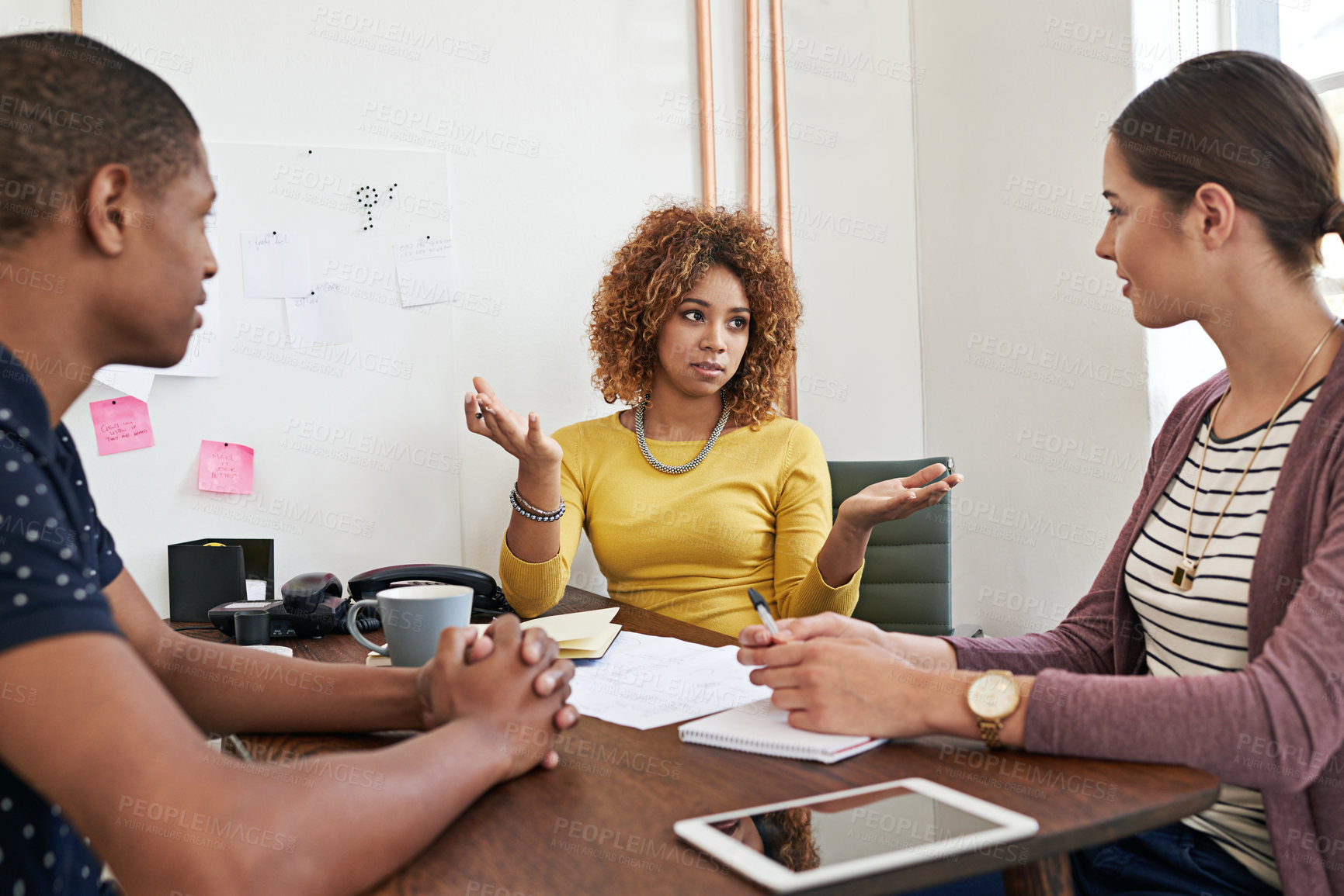 Buy stock photo Shot of a group of colleagues having a meeting in a modern office