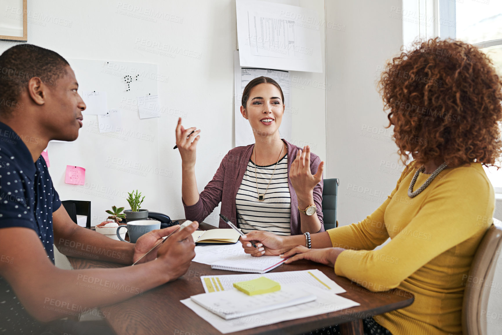 Buy stock photo Shot of a group of colleagues having a meeting in a modern office