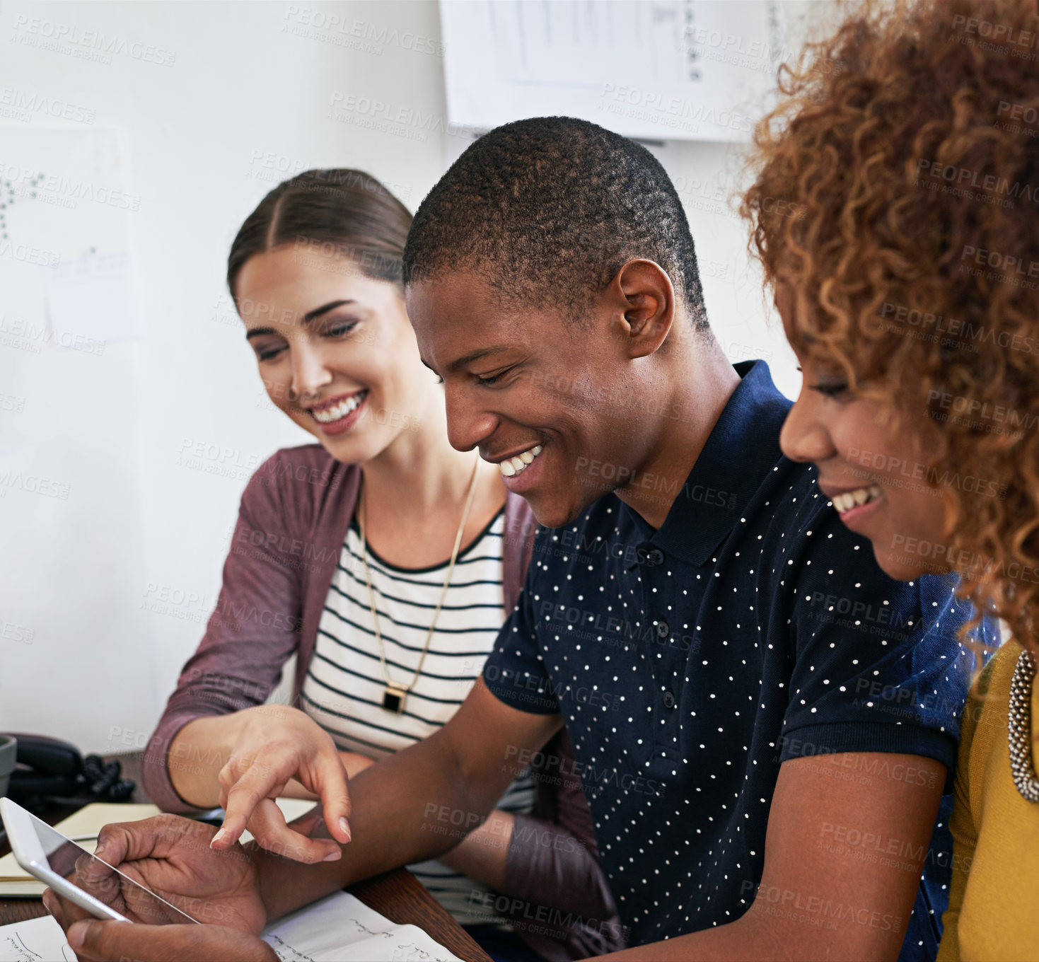 Buy stock photo Shot of a group of colleagues having a meeting in a modern office