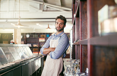 Buy stock photo Crossed arms, smile and portrait of waiter in pub with confidence for hospitality career. Happy, pride and male bartender standing with positive attitude in restaurant or cafe for alcohol service.