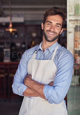 Buy stock photo Cropped portrait of a young barista standing in a coffee shop