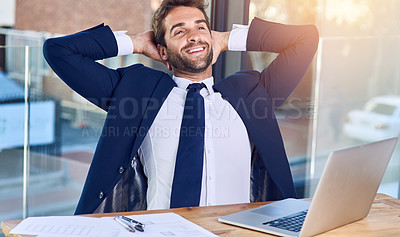 Buy stock photo Shot of a businessman looking relaxed in his office