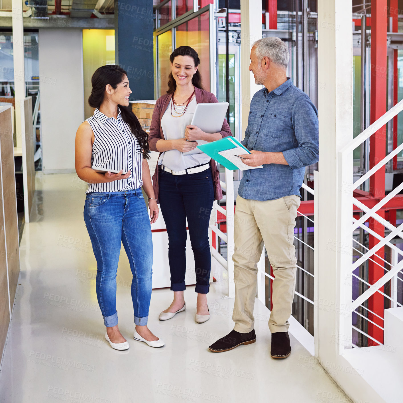 Buy stock photo Full length shot of three colleagues standing in the office