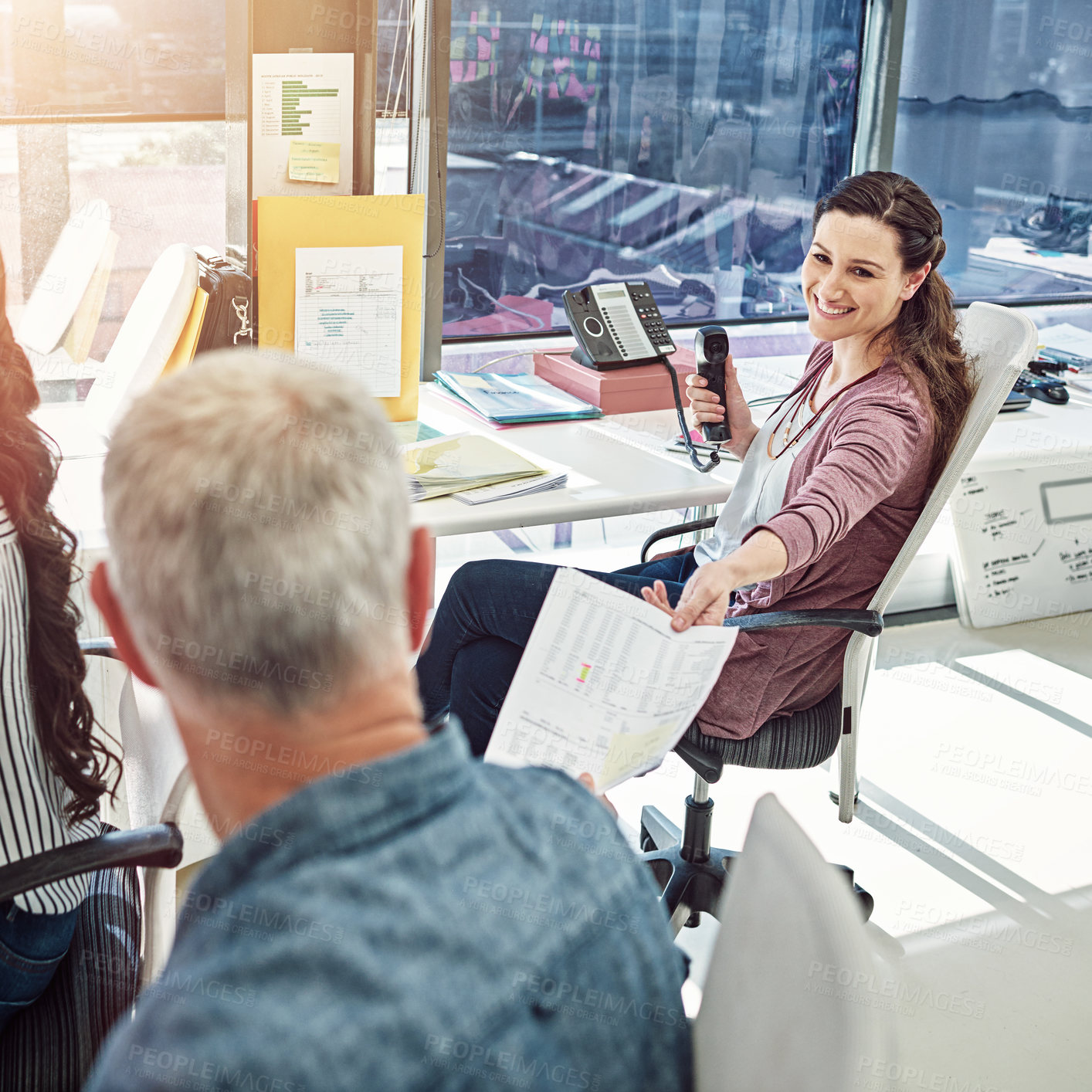 Buy stock photo Cropped shot of two colleagues working in the office