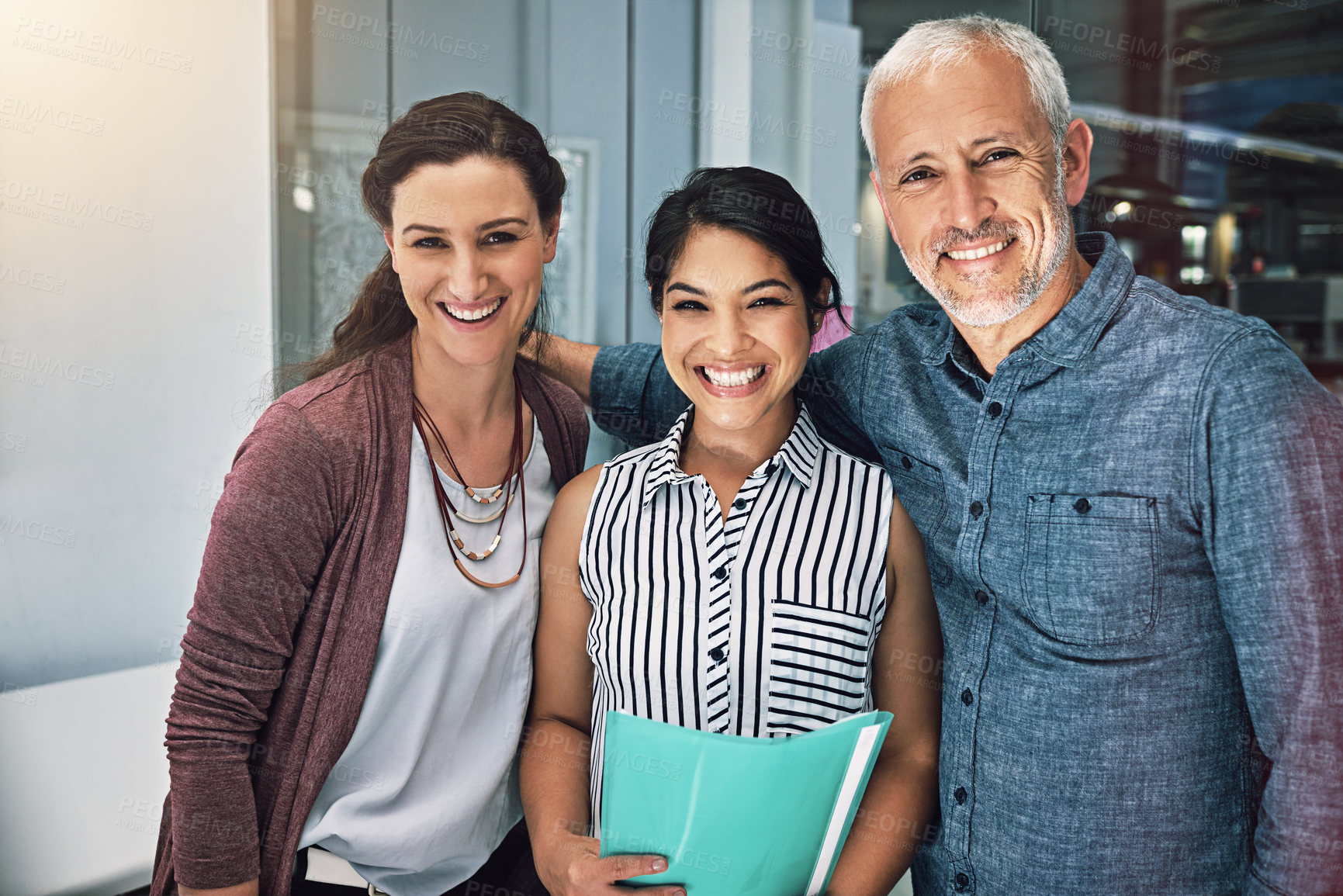Buy stock photo Cropped portrait of three colleagues standing in the office