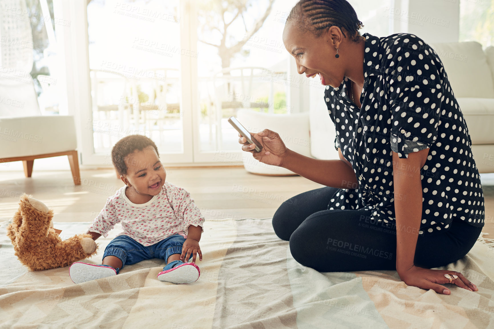 Buy stock photo Shot of a mother taking a photo of her baby girl