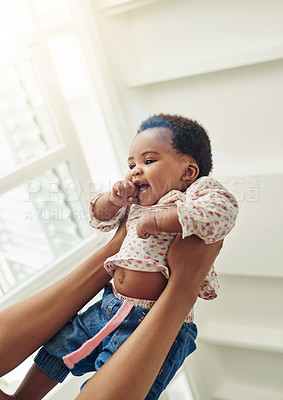 Buy stock photo Shot of a mother holding her smiling baby girl