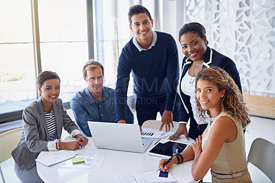 Buy stock photo Portrait of a group of coworkers working together on a laptop in an office