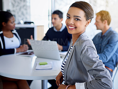 Buy stock photo Portrait of a young businesswoman with colleagues in the background