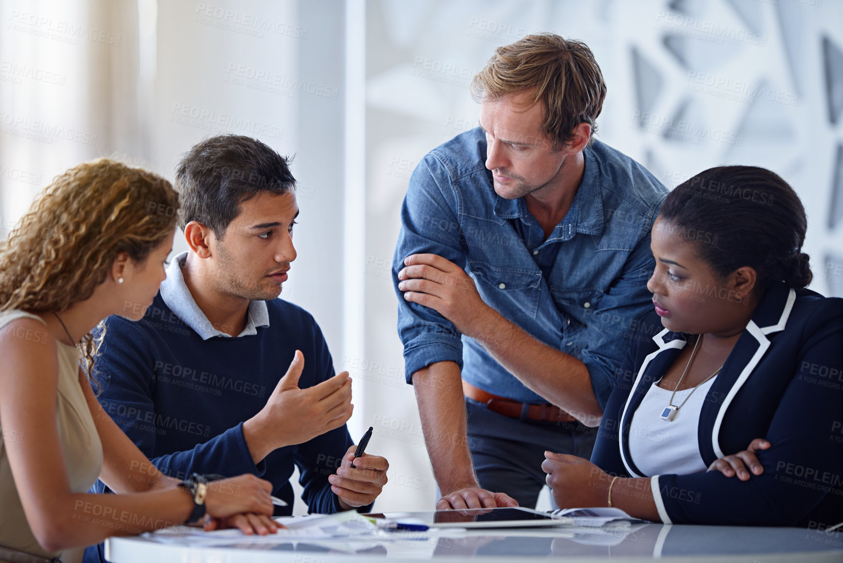 Buy stock photo Shot of a group of colleagues working together in an office