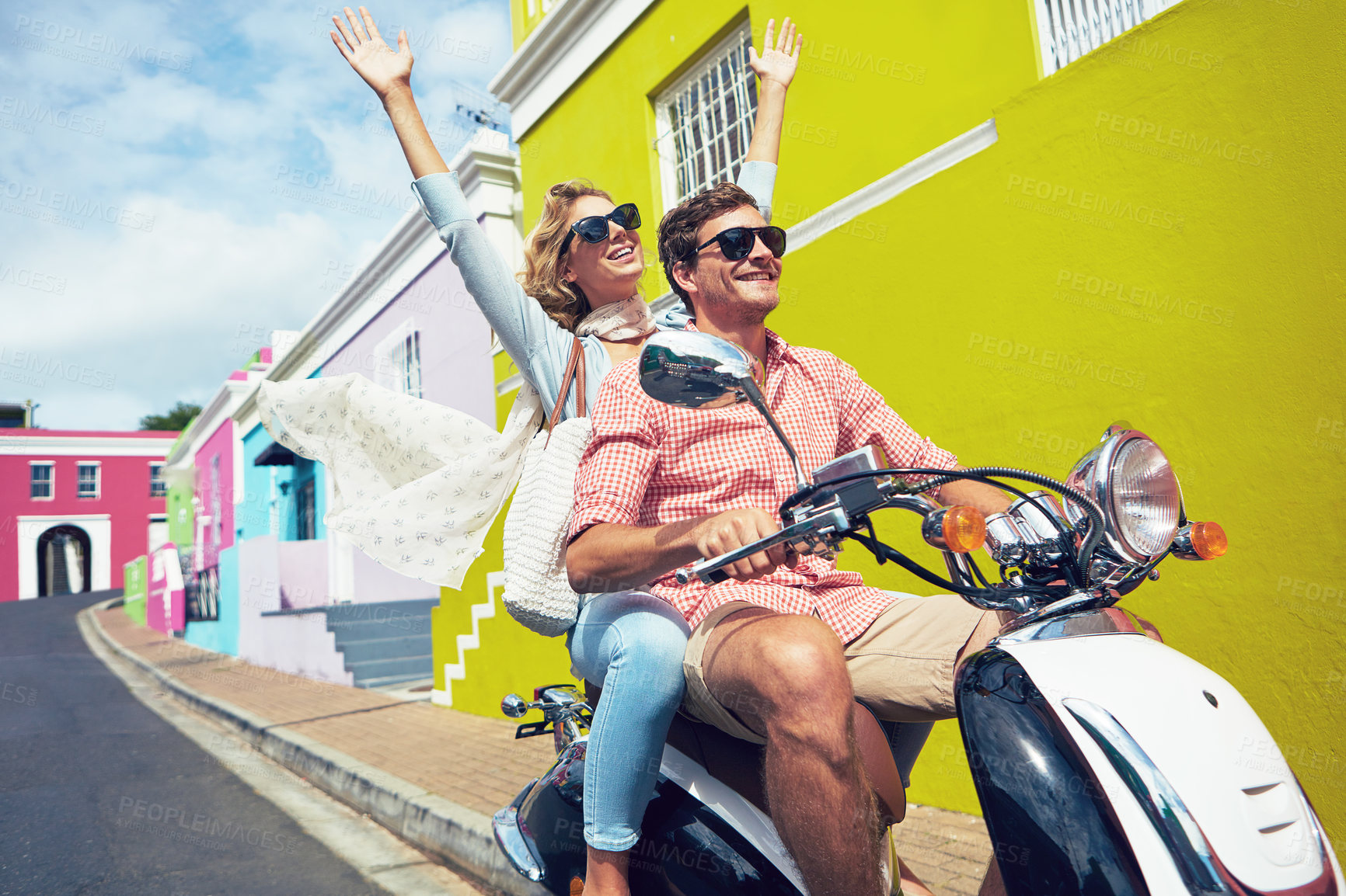 Buy stock photo Scooter, fun and couple with sunglasses in city on holiday, getaway or weekend trip together. Motorcycle, riding and man with woman for drive in town for adventure, sightseeing or travel on vacation.