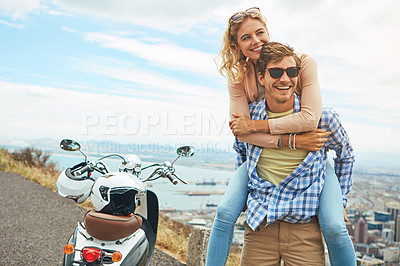 Buy stock photo Shot of a young couple enjoying a day outdoors