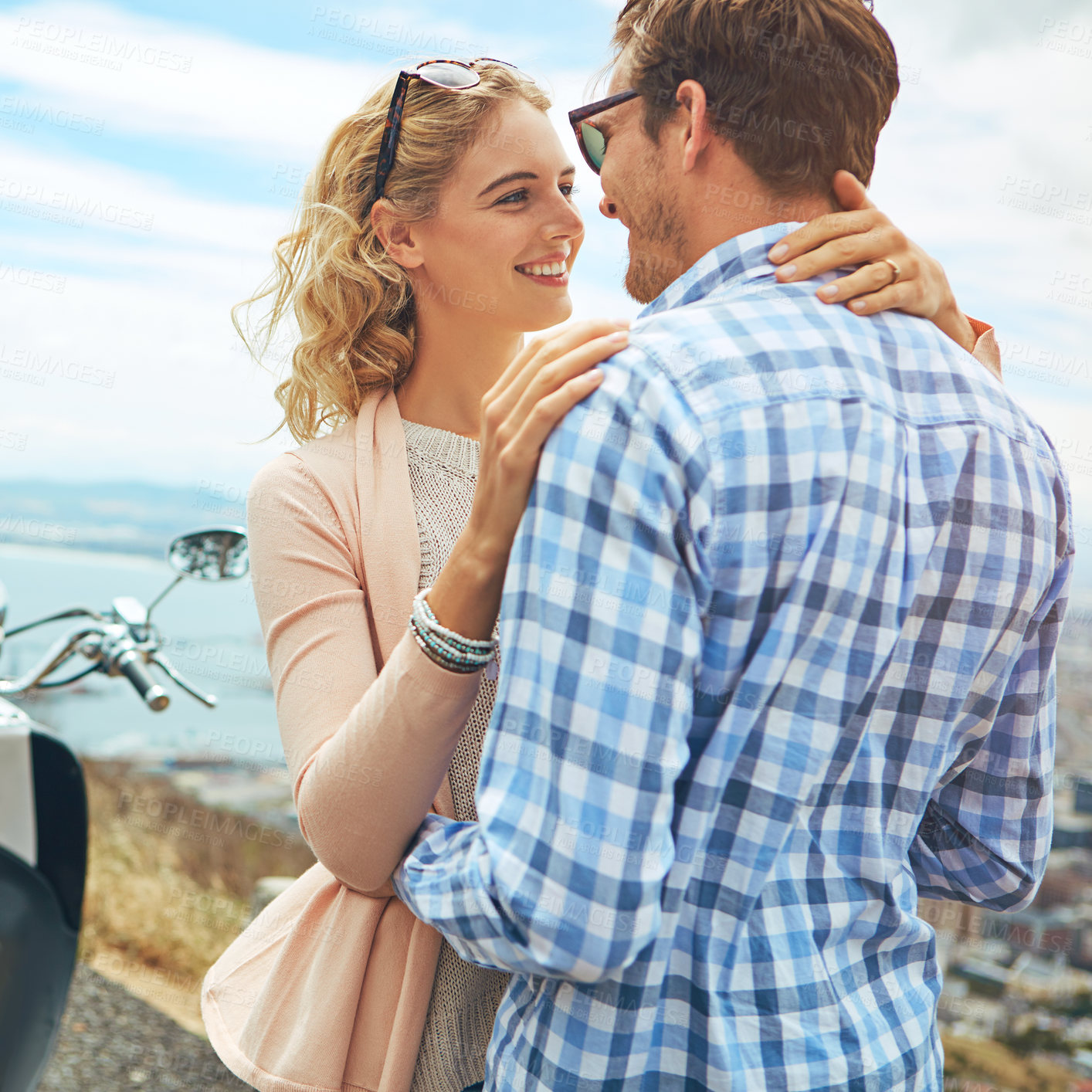 Buy stock photo Shot of a couple having a intimate moment while out on the road