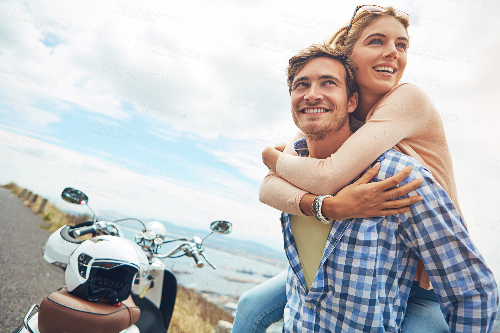 Buy stock photo Shot of a young man piggybacking his girlfriend