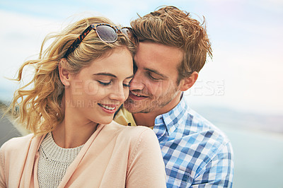 Buy stock photo Shot of a young couple enjoying a day outdoors