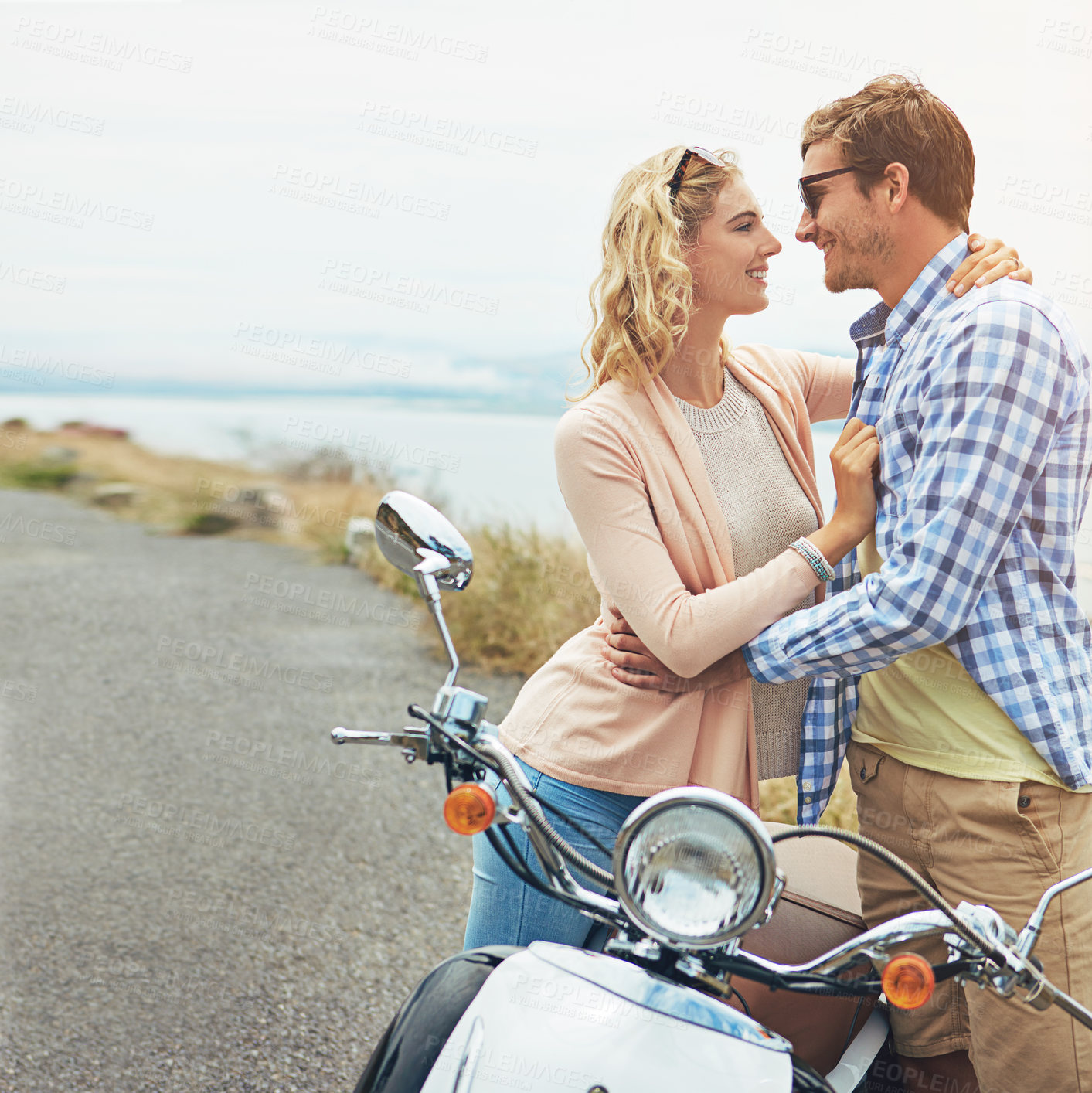 Buy stock photo Shot of a couple having a intimate moment while out on the road