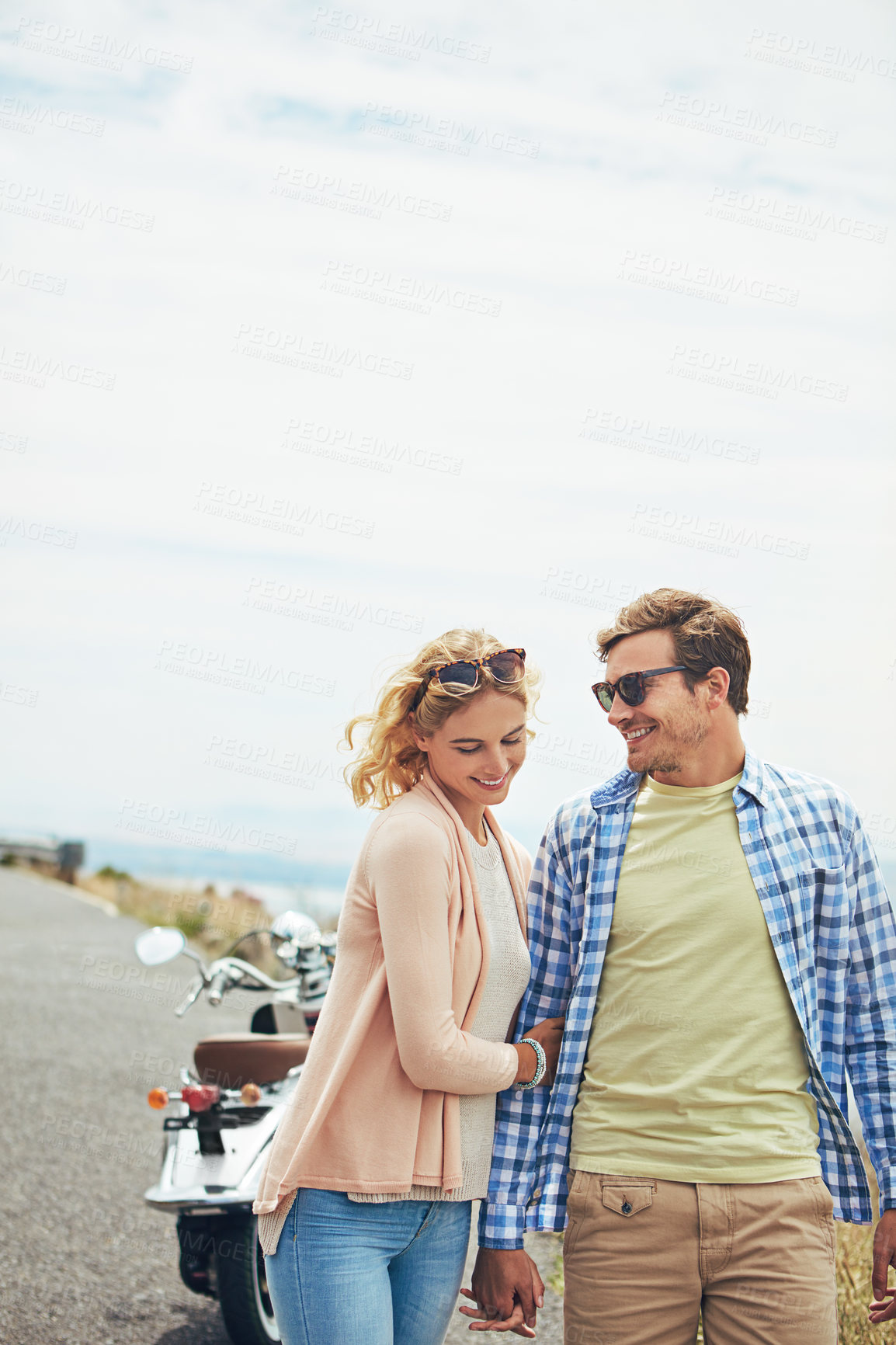 Buy stock photo Shot of a young couple enjoying a day outdoors