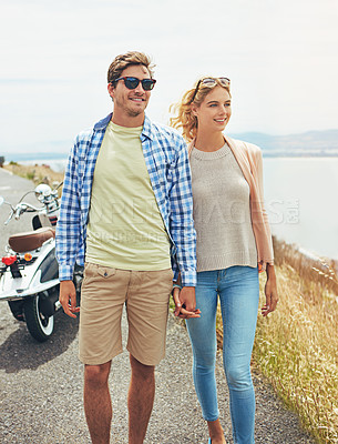 Buy stock photo Shot of a young couple enjoying a day outdoors