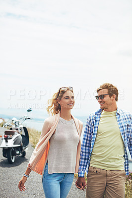 Buy stock photo Shot of a young couple enjoying a day outdoors