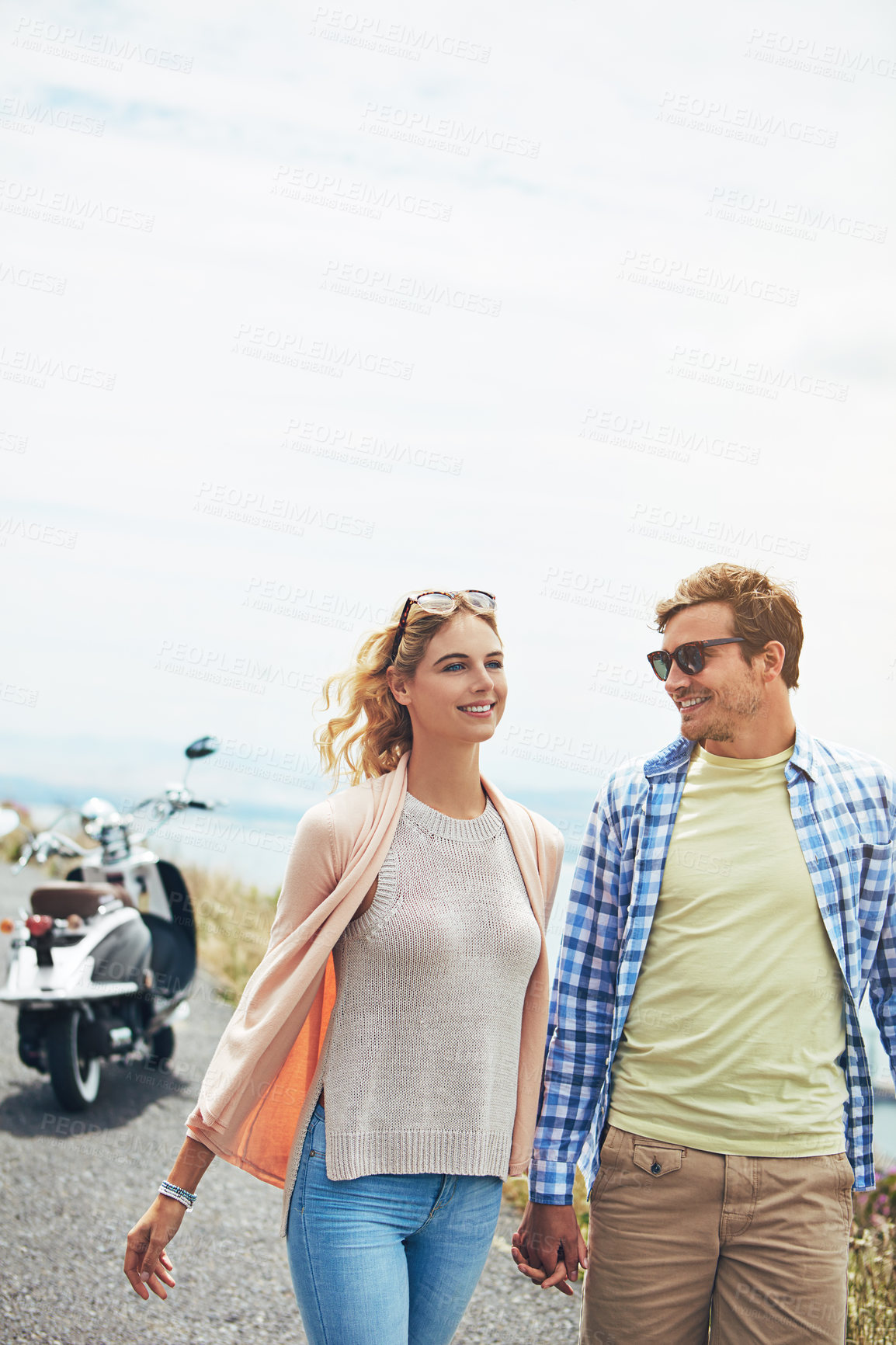 Buy stock photo Shot of a young couple enjoying a day outdoors