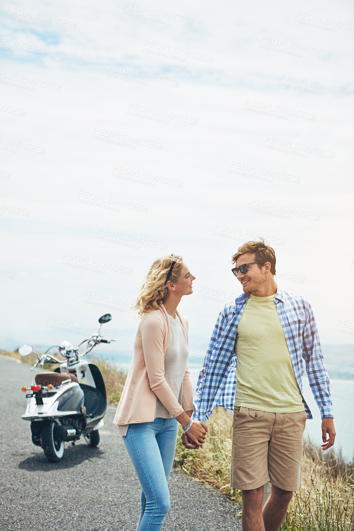 Buy stock photo Holding hands, smile and date with couple and scooter for honeymoon vacation, explore and road trip. Summer adventure, walking and bonding with man and woman outdoor for love, holiday and space