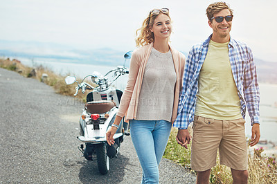 Buy stock photo Shot of a young couple enjoying a day outdoors