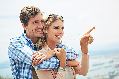 Buy stock photo Shot of a young couple enjoying a day outdoors