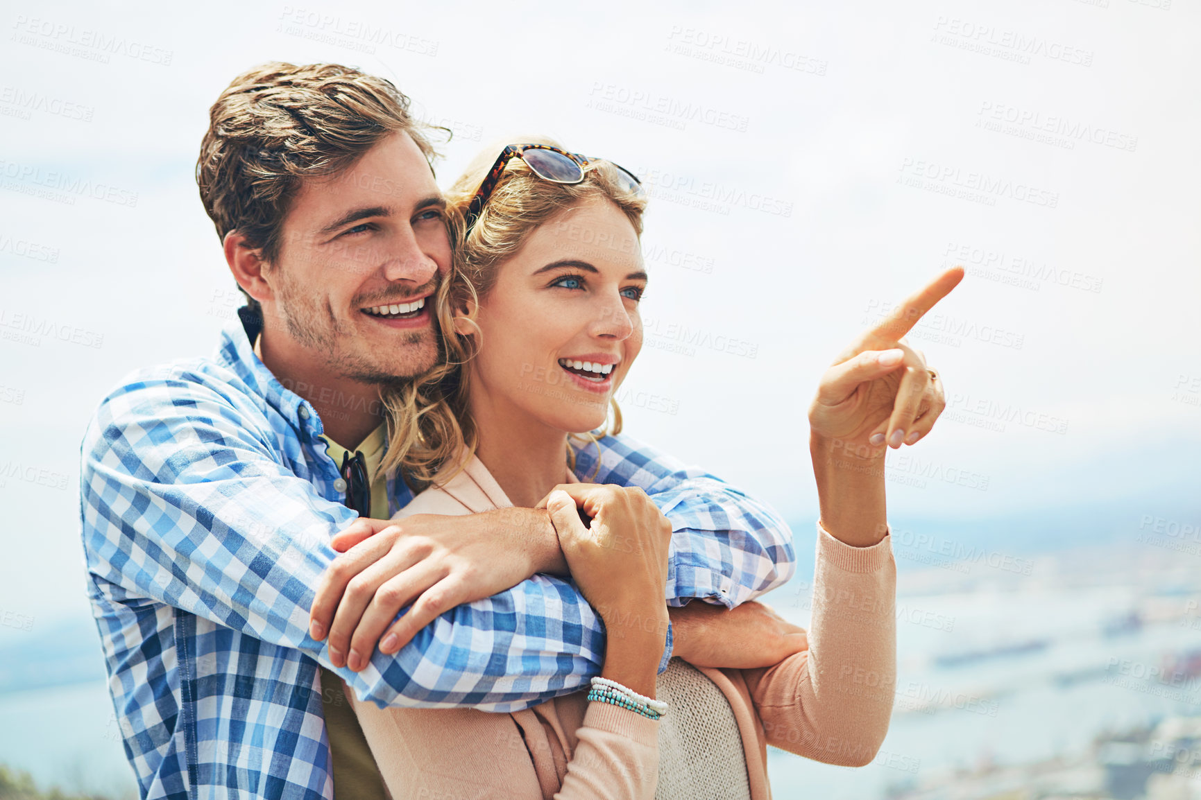 Buy stock photo Shot of a young couple enjoying a day outdoors