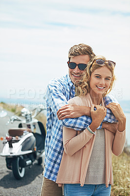 Buy stock photo Shot of a young couple enjoying a day outdoors