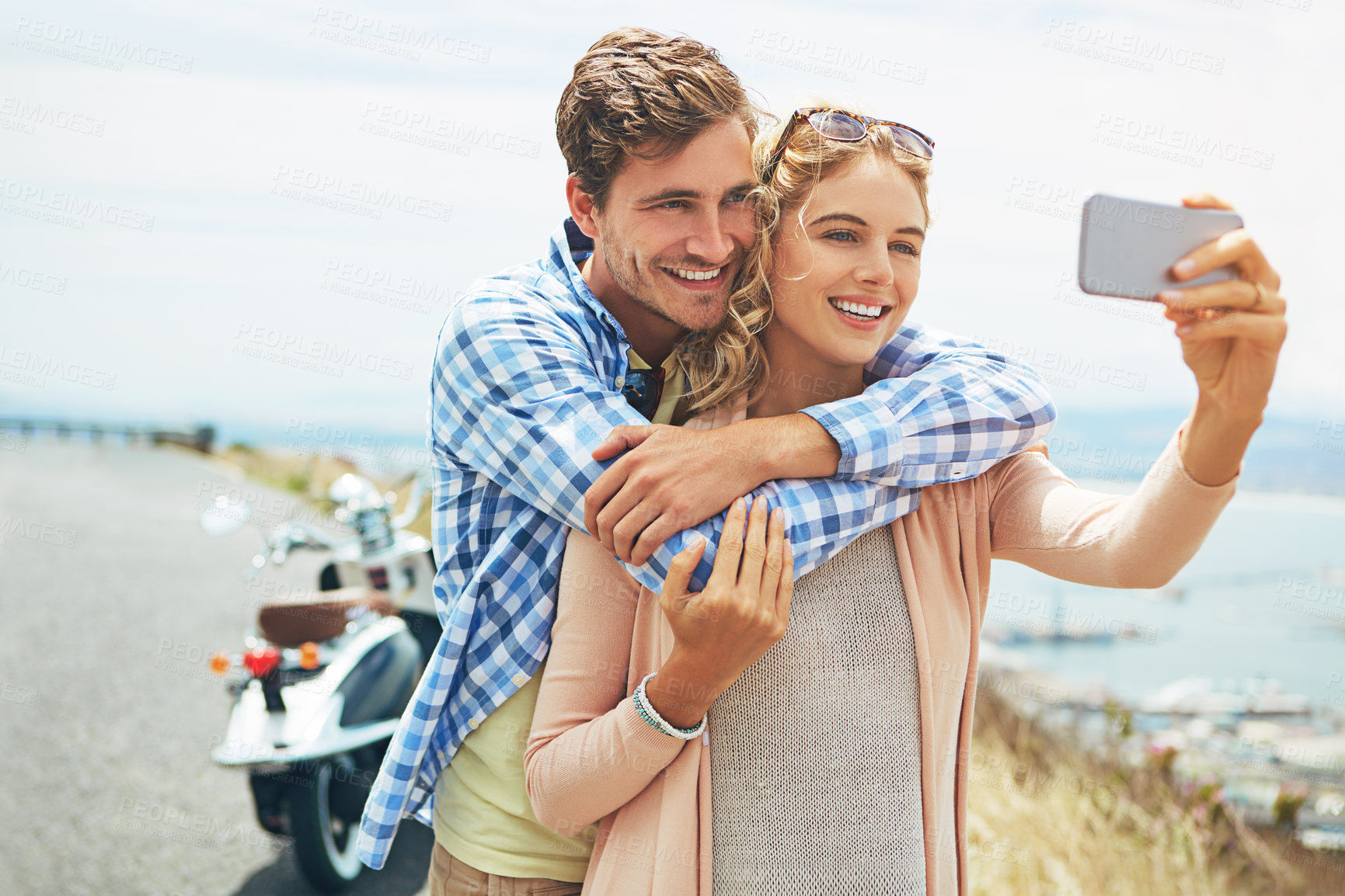 Buy stock photo Shot of a couple taking a selfie outdoors