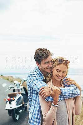 Buy stock photo Shot of a couple having a intimate moment while out on the road