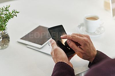 Buy stock photo Cropped shot of a man using a phone at his desk in an office