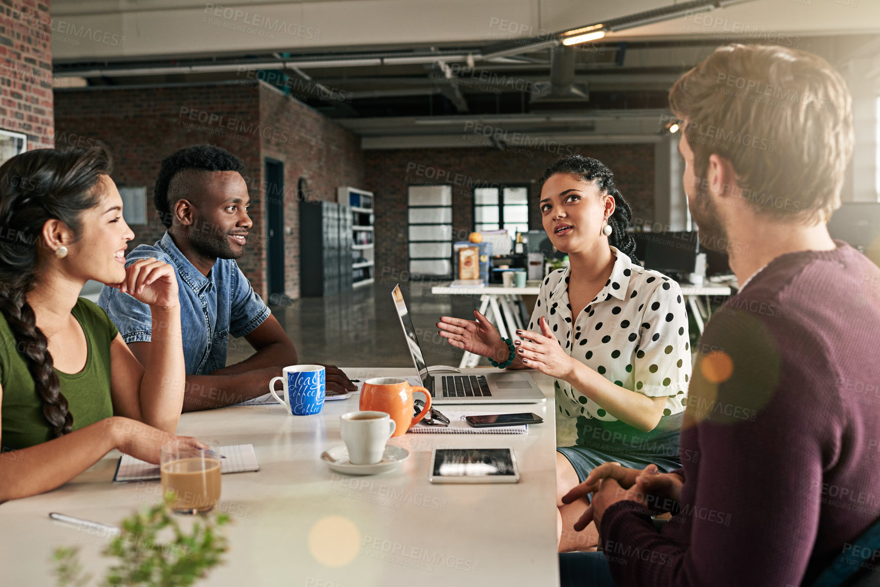 Buy stock photo Shot of a team of colleagues having a meeting in a modern office