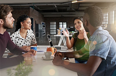 Buy stock photo Shot of a team of colleagues having a meeting in a modern office