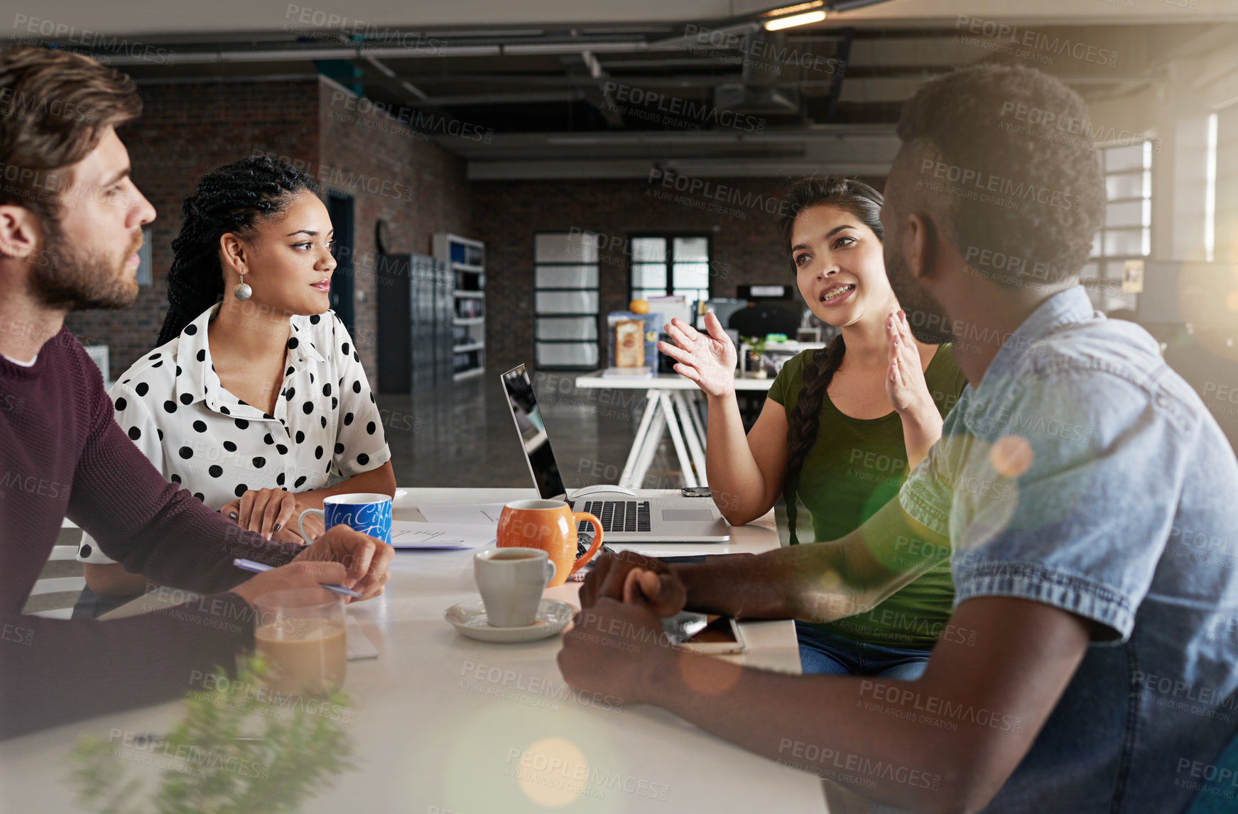 Buy stock photo Shot of a team of colleagues having a meeting in a modern office