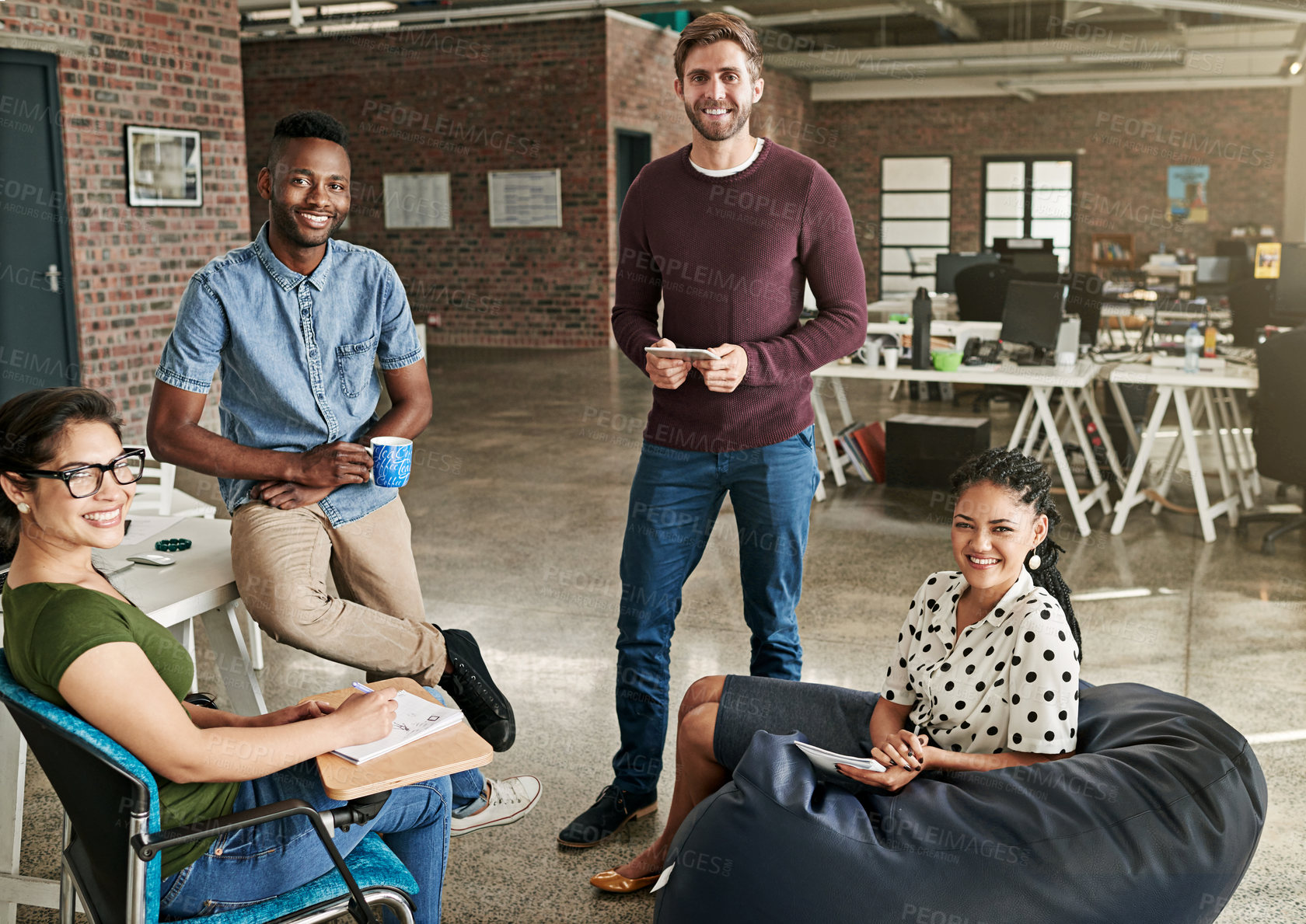 Buy stock photo Shot of a team of colleagues having a meeting in a modern office