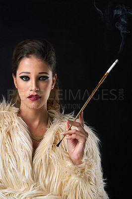 Buy stock photo Vintage, woman and makeup portrait with cigarette in studio with retro fashion, glamour style or confidence. Model, person and smoking with fur coat, cosmetics or classy aesthetic on black background