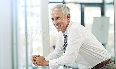 Buy stock photo Cropped shot of a mature businessman leaning over the balcony in his office