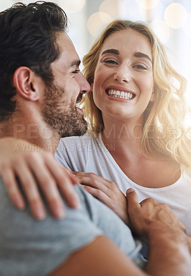 Buy stock photo Shot of a young couple relaxing at home