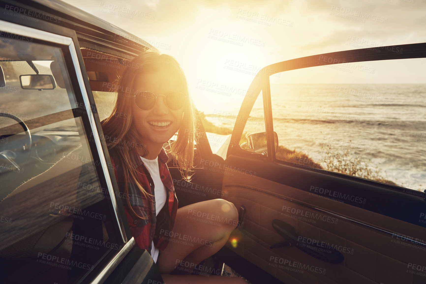 Buy stock photo Happy woman, portrait and sunglasses with beach sunset for road trip, travel or outdoor journey in nature. Female person, tourist or summer holiday with smile in car for adventure by ocean coast